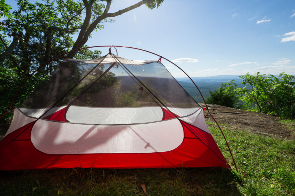 MSR backpacking tent overlooking green hills