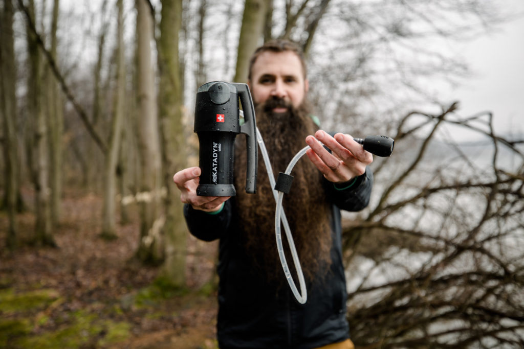 Steven holding Katadyn pump filter along Pennsylvania river