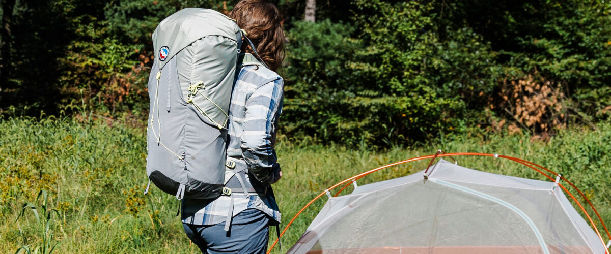 woman outdoors backpacking