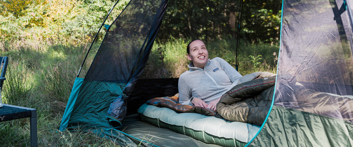 photo of woman camping outdoors