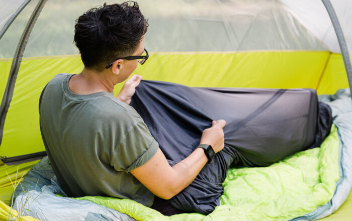 Person cmaping using Big Agnes UL Recovery UL Sleeping Bag Liner
