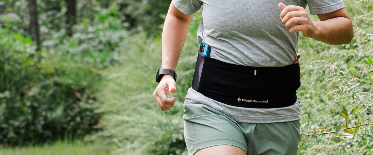 person running outdoors with Black Diamond Distance Run Belt