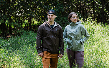 Two people outdoors wearing jackets
