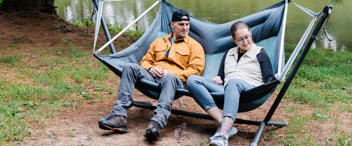 Two people outdoors sitting in ENO Doubleloft Hammock Chair