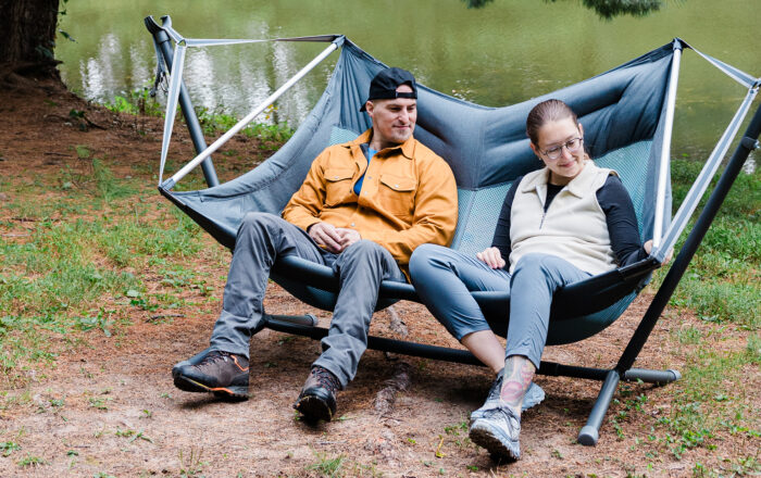 Two people outdoors sitting in ENO Doubleloft Hammock Chair