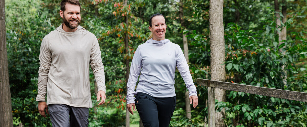 Two people outdoors wearing hoodies