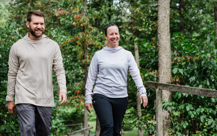 Two people outdoors wearing hoodies