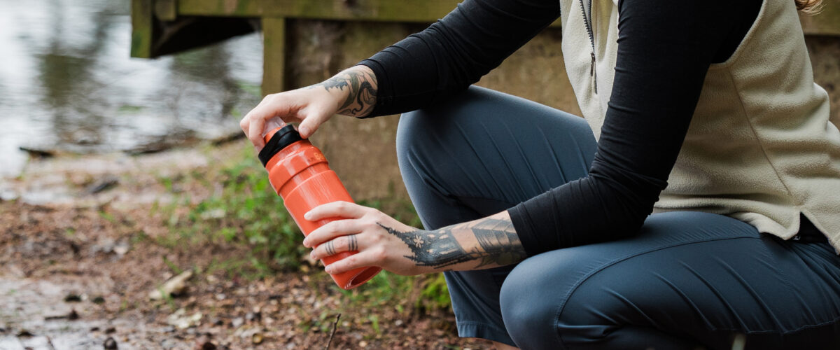 Person outdoors using the Katadyn BeFree AC 0.7L Bottle
