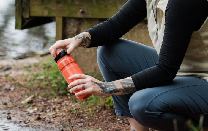 Person outdoors using the Katadyn BeFree AC 0.7L Bottle