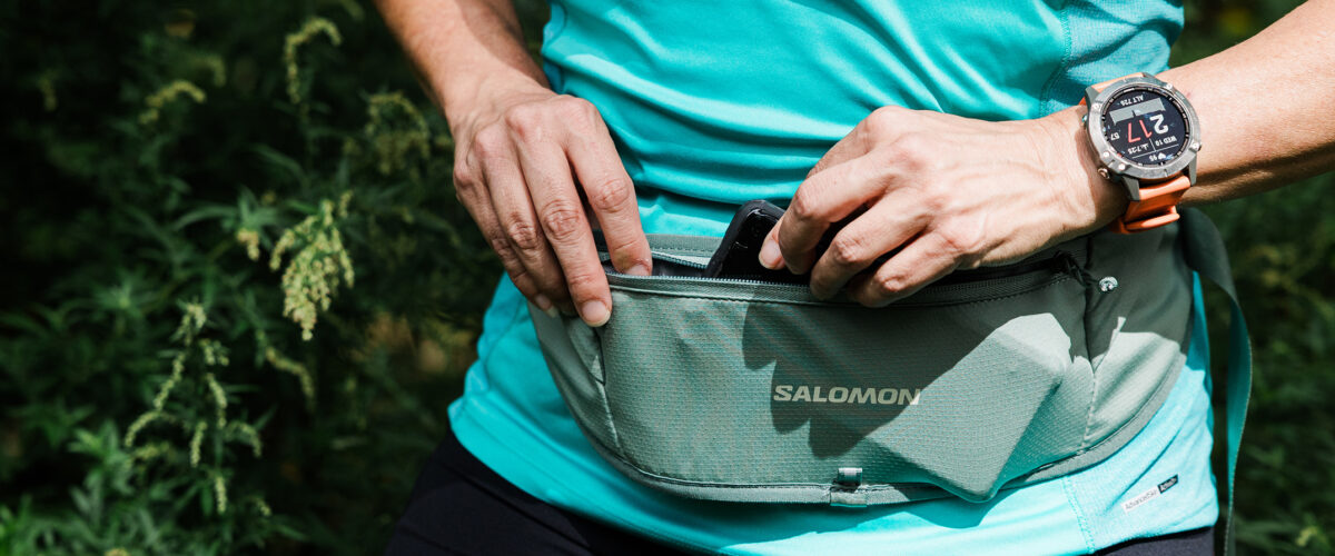 Trail runner outdoors with Salomon Pulse Sling Belt