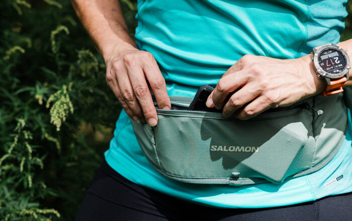 Trail runner outdoors with Salomon Pulse Sling Belt