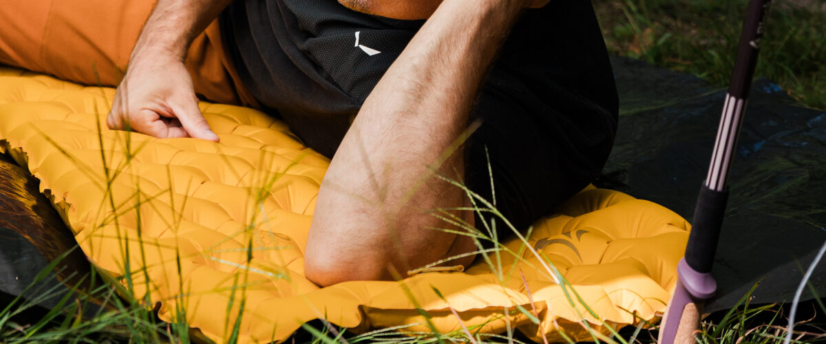 person lying on sleeping pad