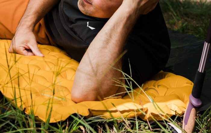 person lying on sleeping pad