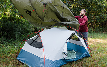 man outdoors camping