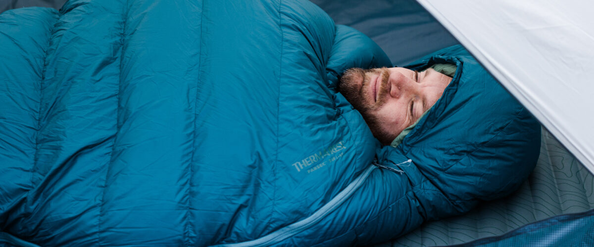 man sleeping in Therm-a-Rest Sleeping bag