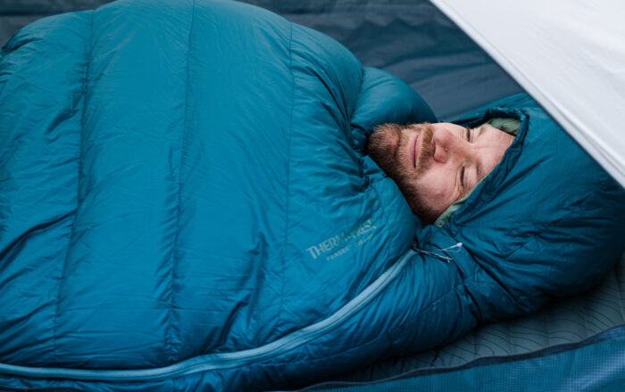 man sleeping in Therm-a-Rest Sleeping bag